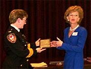Chief Chambers accepts plaque from NCPPA Div II